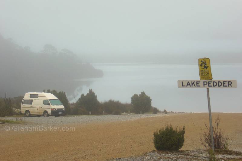 Part of Ted's Beach Campground, with mist over Lake Pedder