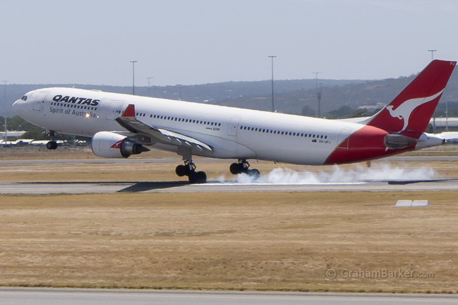 A Qantas A330 touching down at Perth Airport
