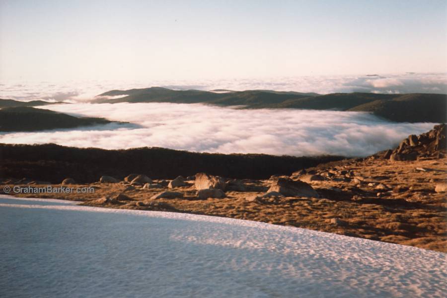 Looking down on cloud-filled valleys at dawn from the Ramshead Range, NSW, Australia